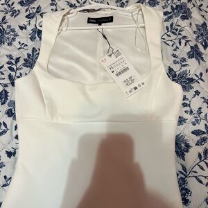 White square neck zara top has a minor stain in the back (bought that way)